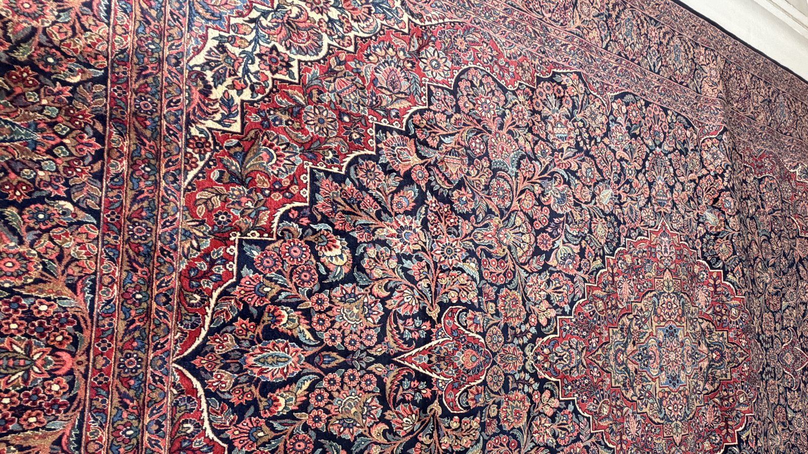 A hand-knotted rug photographed flat after washing, colour fully recovered